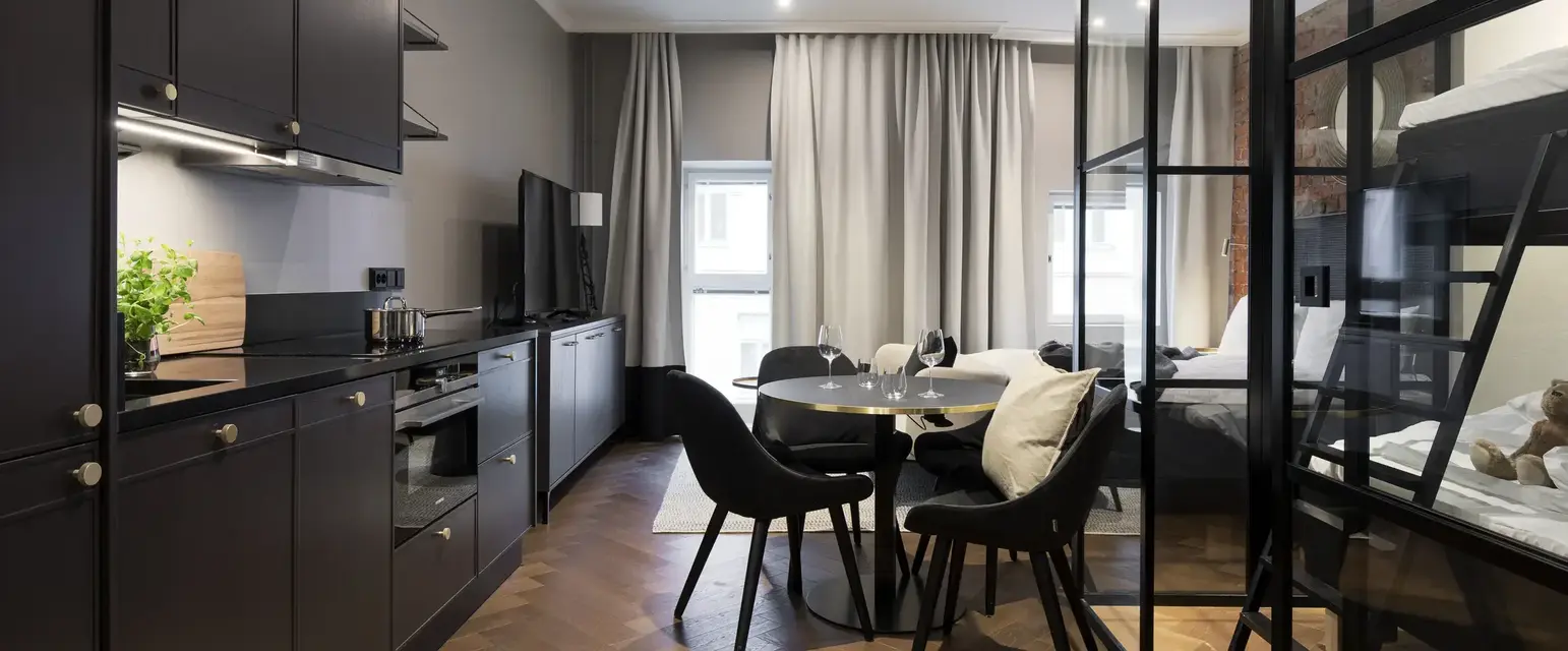 a room with a table and chairs