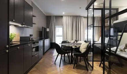 a room with a table and chairs