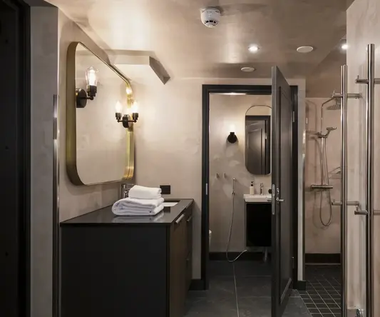a bathroom with a mirror and sink