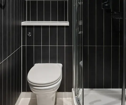 a bathroom with a glass shower door