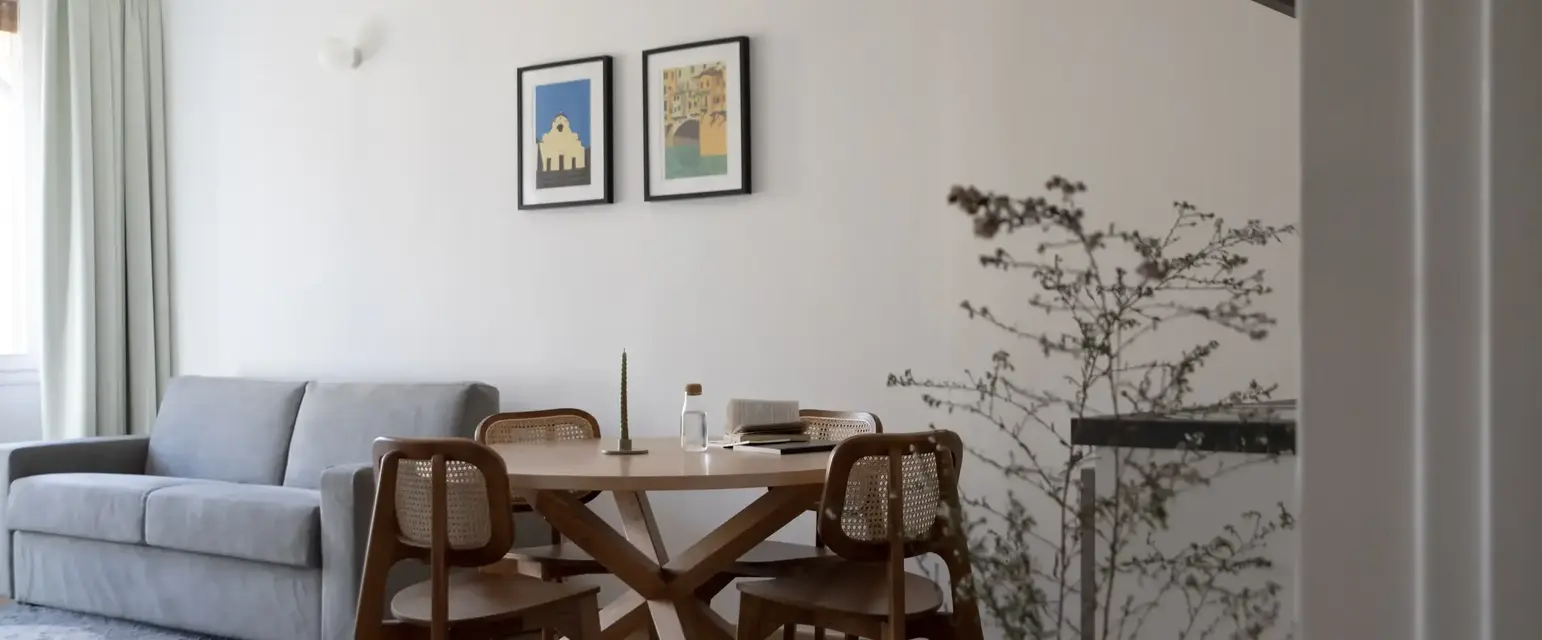a room with a table and chairs