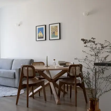 a room with a table and chairs