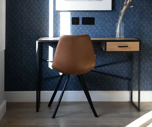 a chair next to a desk
