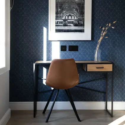 a chair next to a desk