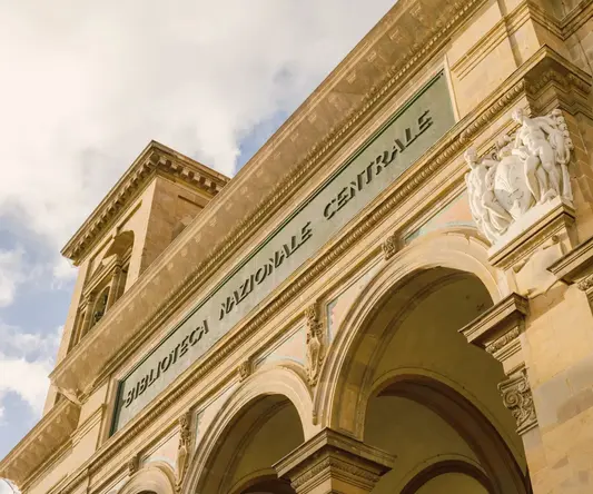 a building with arches and a sign