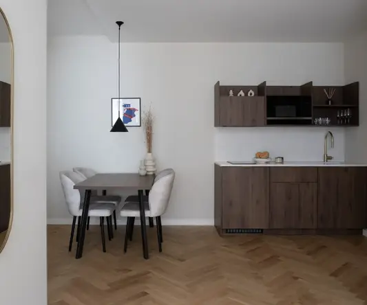 a dining table and chairs in a room