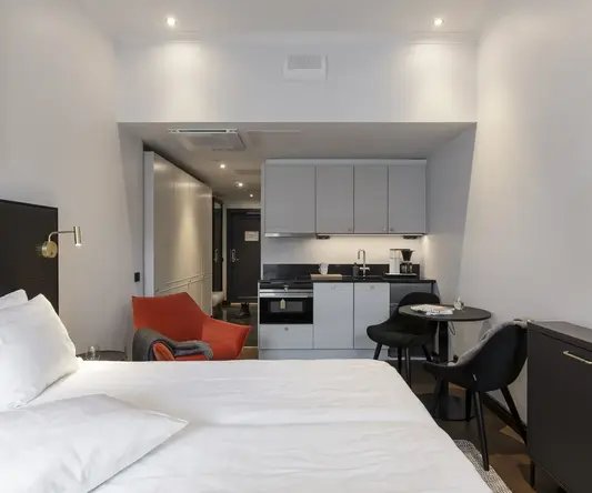 a room with a bed and a small table