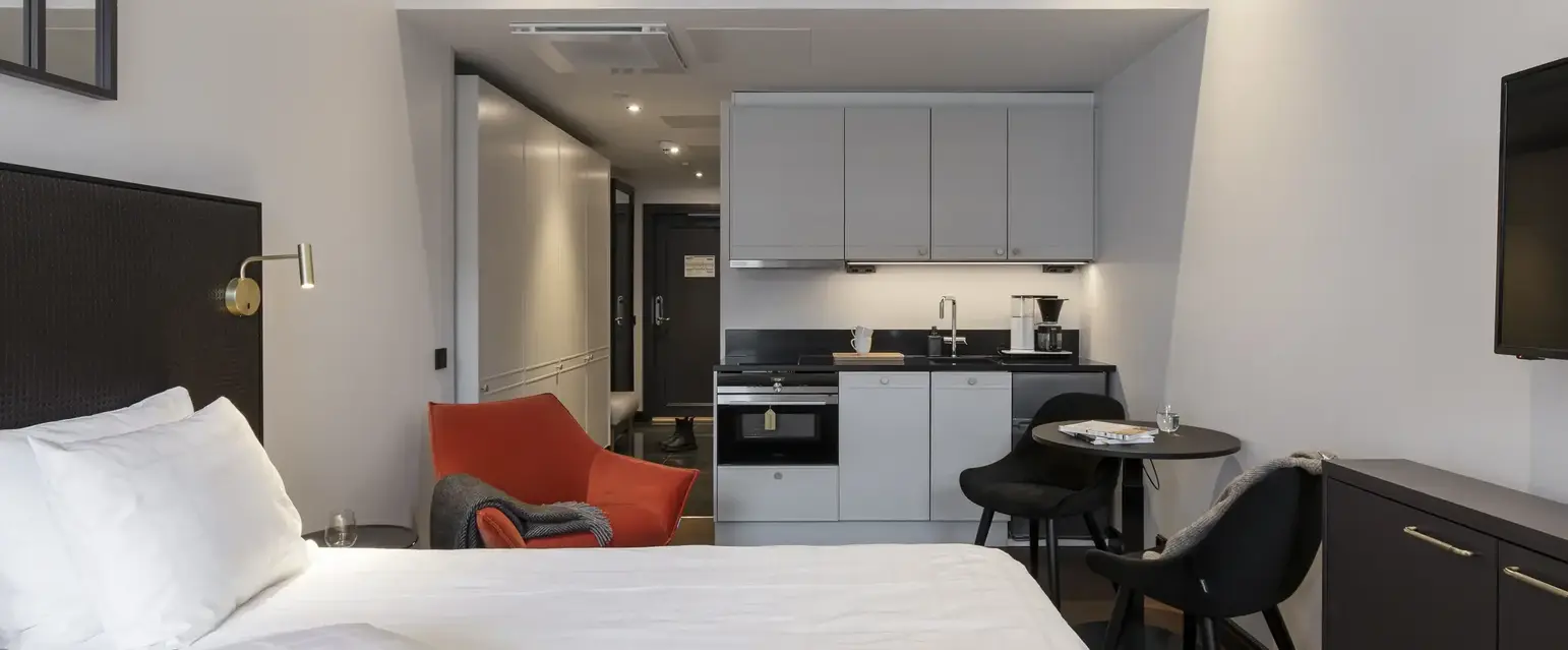 a room with a bed and a small table