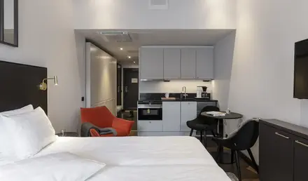 a room with a bed and a small table