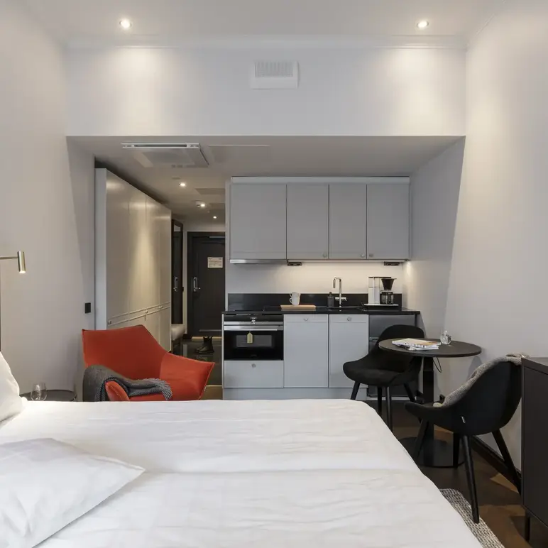 a room with a bed and a small table