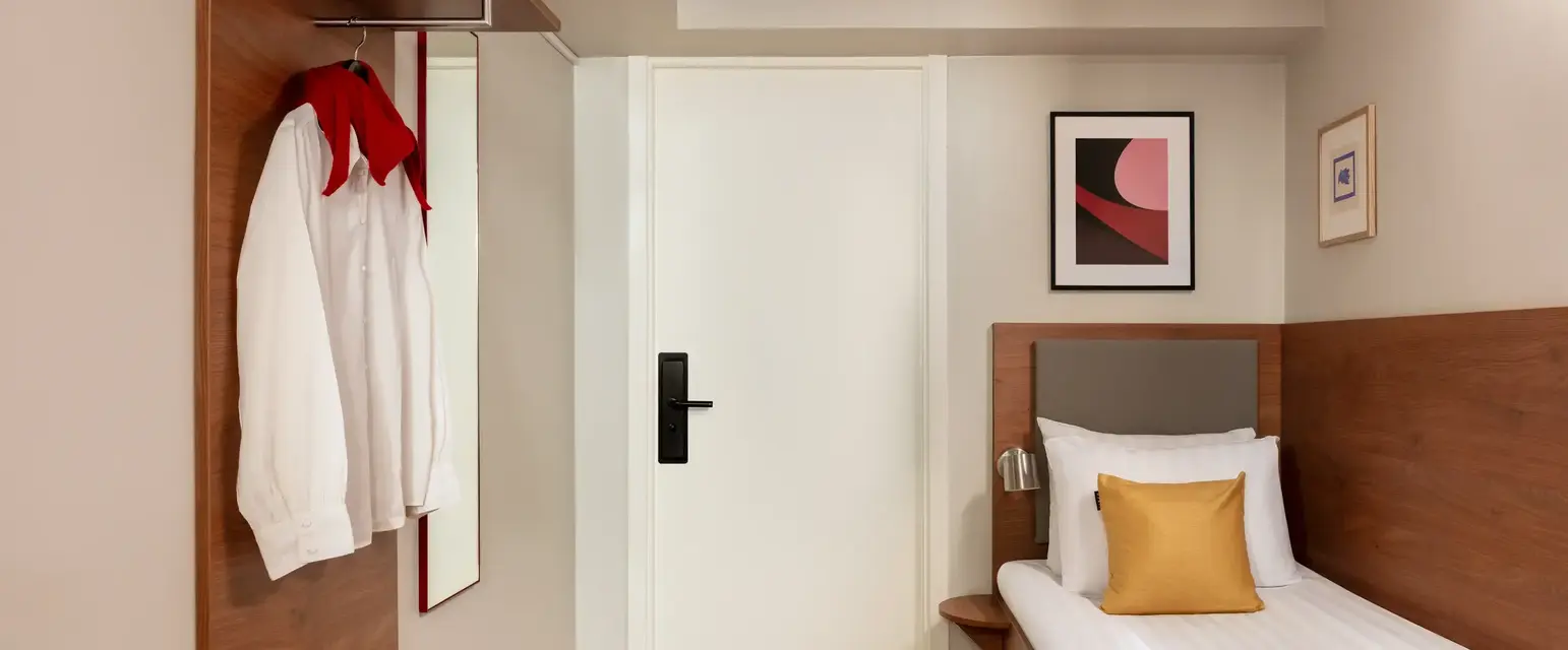 a bedroom with a bed and a white door