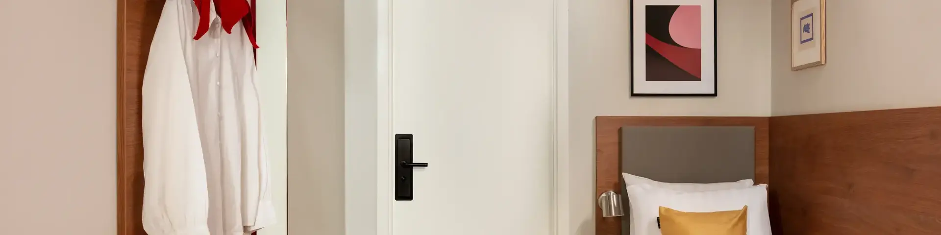 a bedroom with a bed and a white door