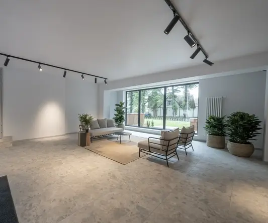 a room with a large window and a couch