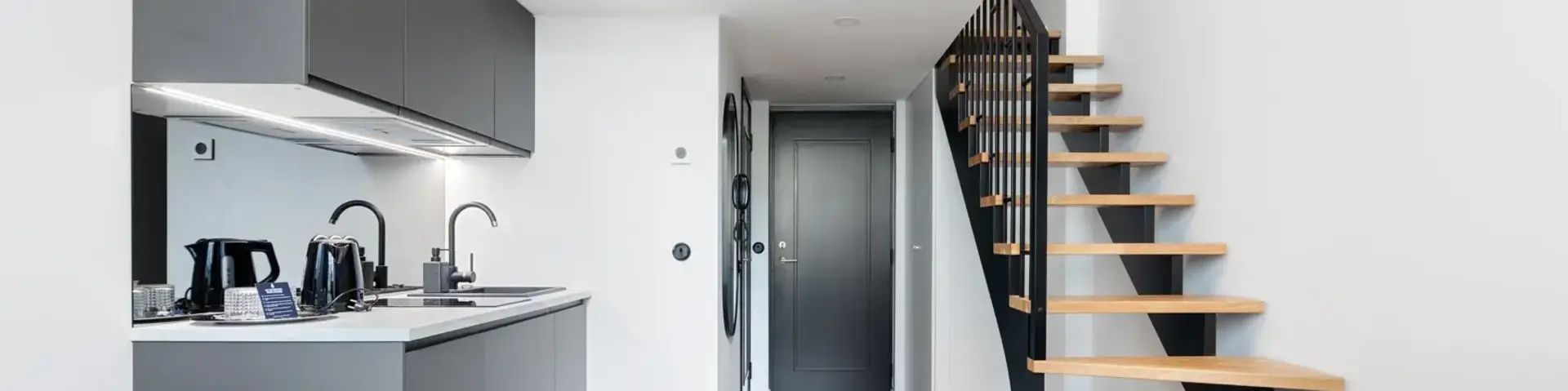 a room with a staircase and a couch