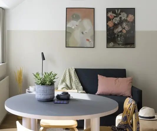 a room with a table and chairs