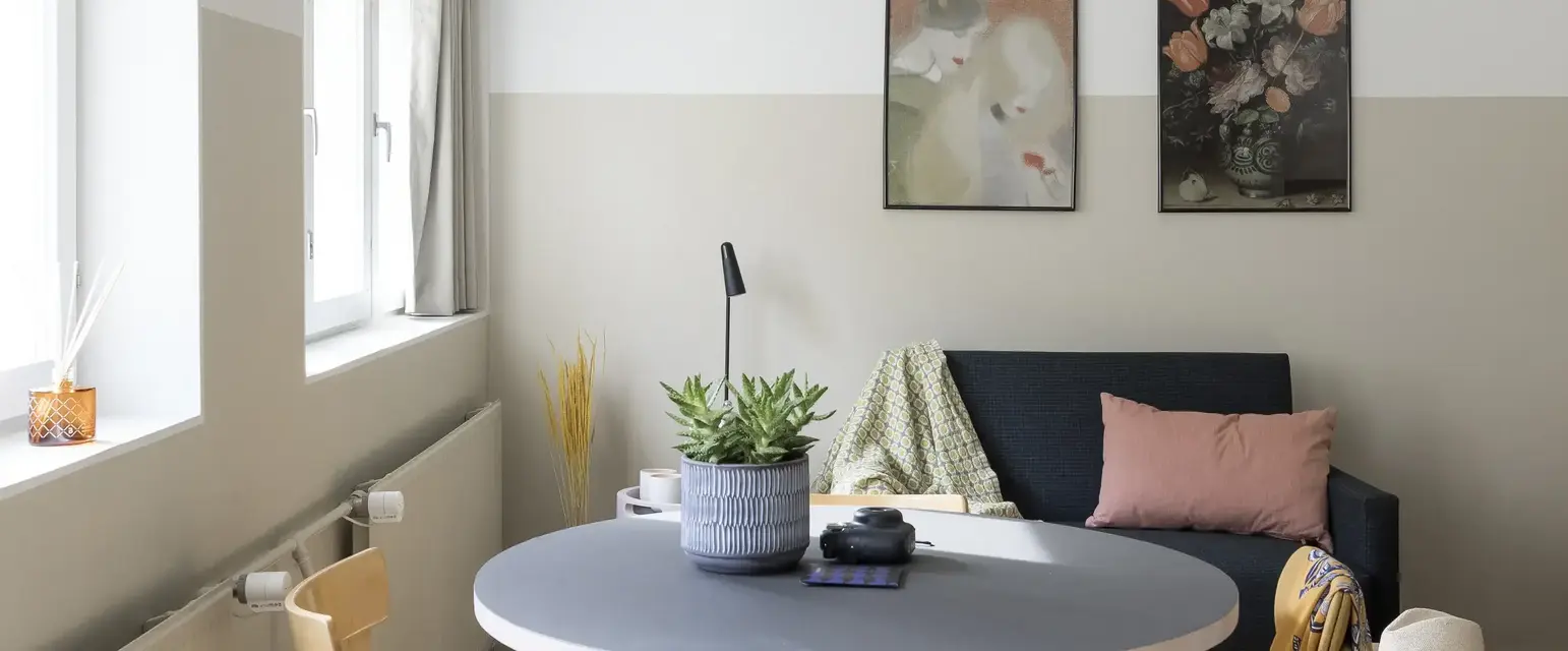 a room with a table and chairs