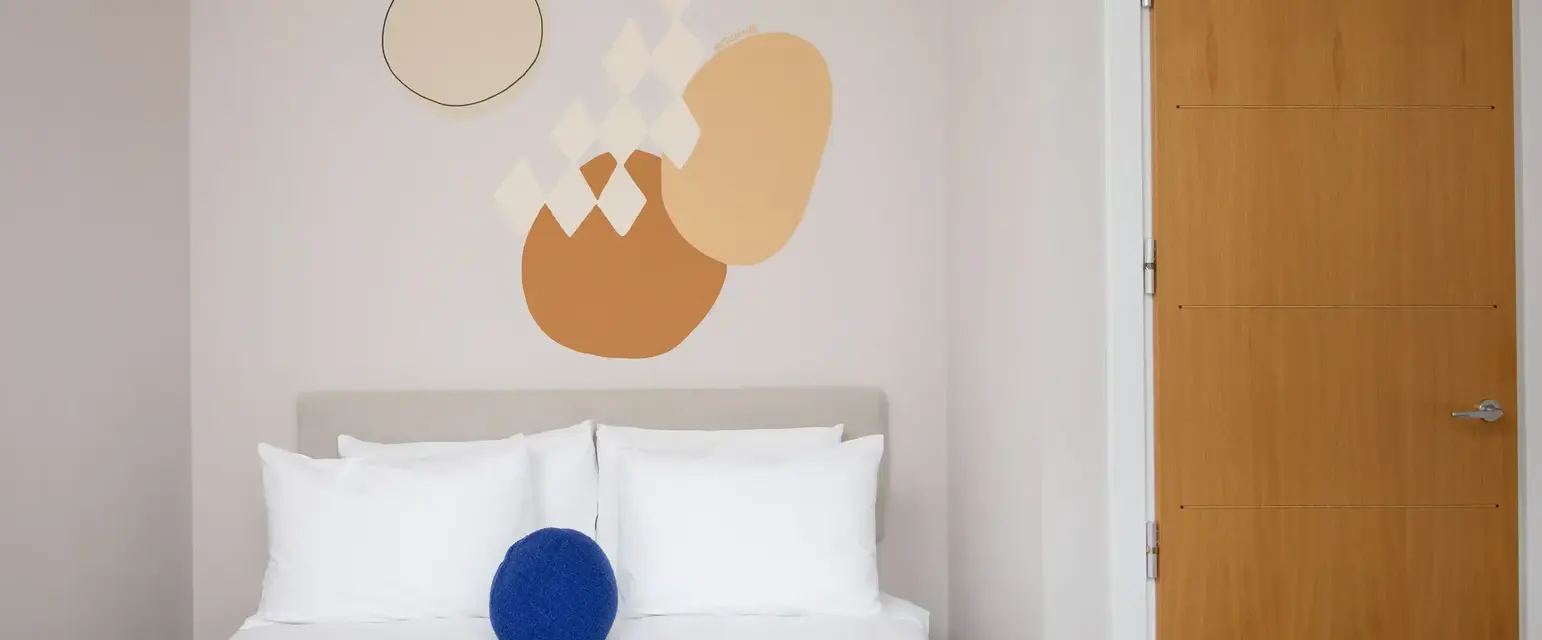 a bed with pillows and a book on it