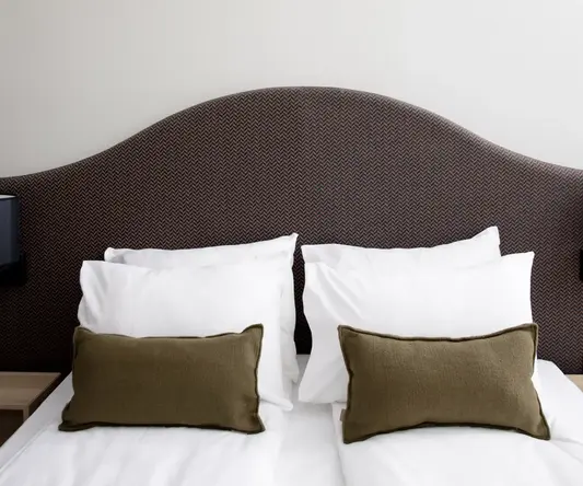 a bed with pillows on it