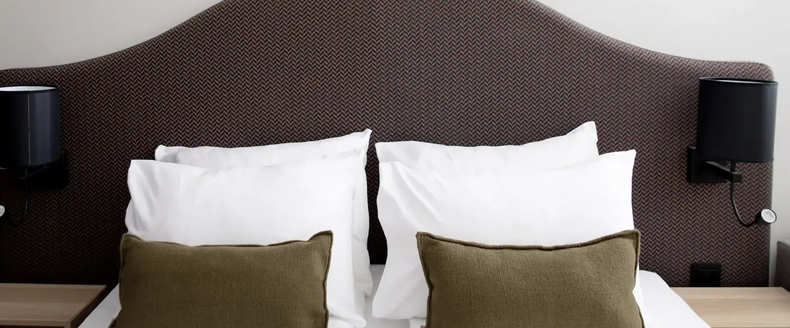 a bed with pillows on it