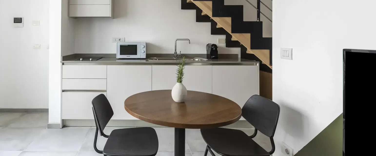 a table and chairs in a kitchen