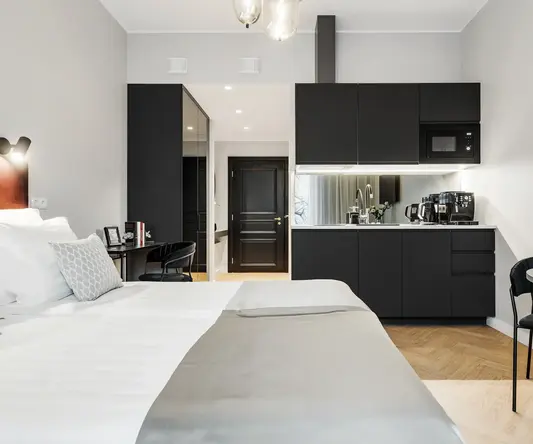 a bedroom with a black and white bed