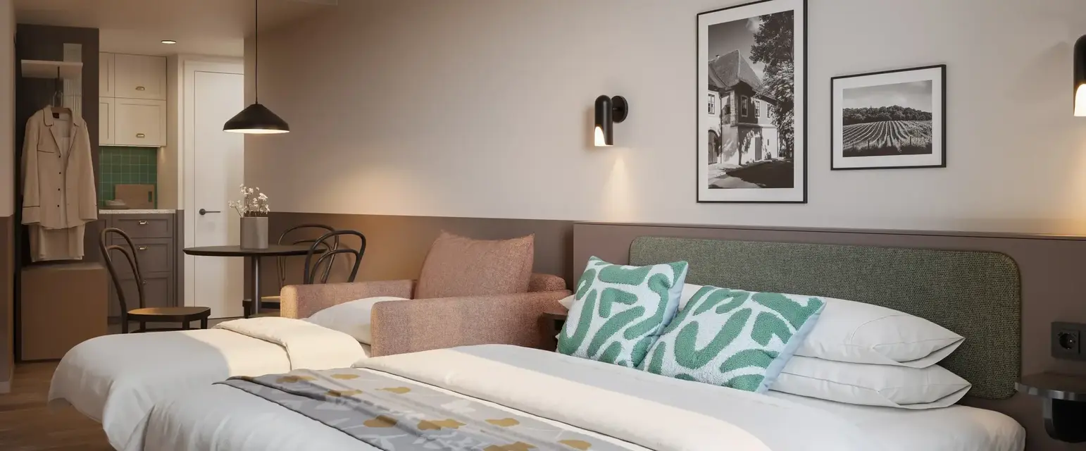 a bed with pillows and a chair in a room