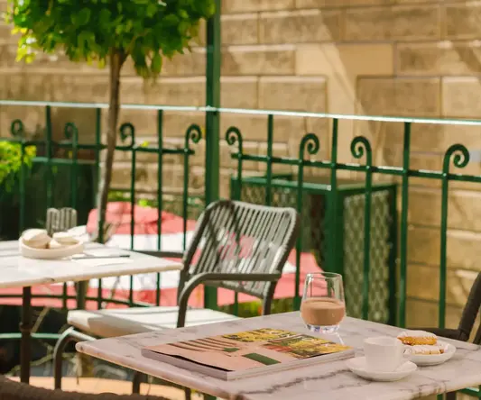 a table and chairs outside a building
