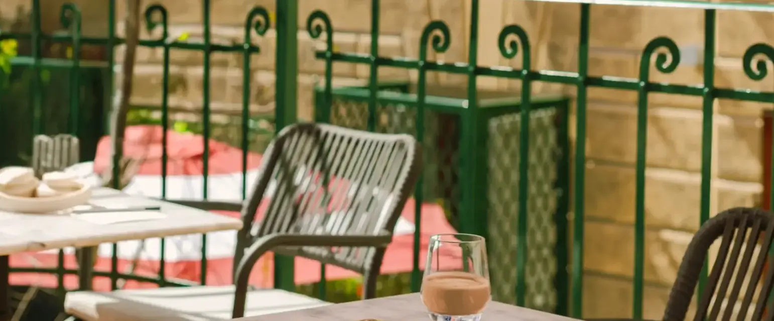 a table and chairs outside a building