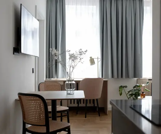 a room with a table and chairs