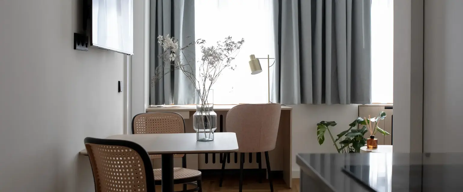 a room with a table and chairs