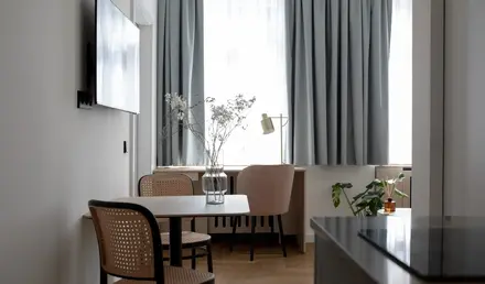 a room with a table and chairs