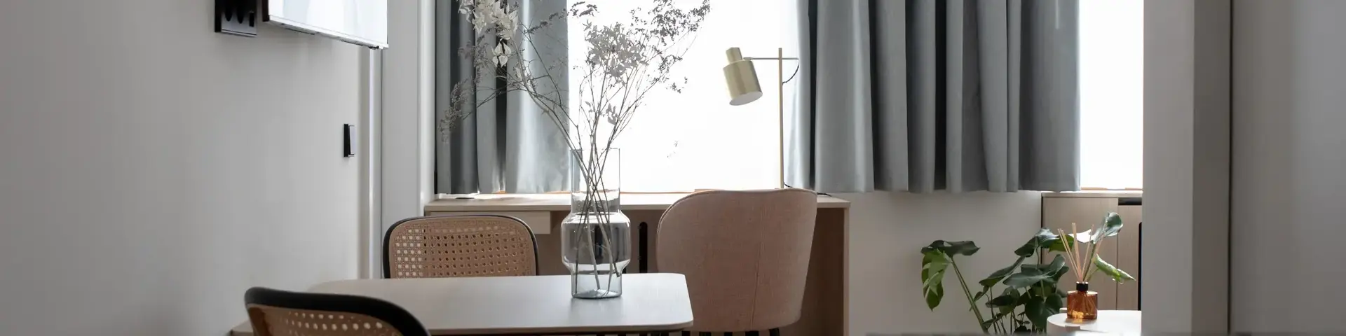 a room with a table and chairs