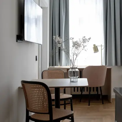 a room with a table and chairs
