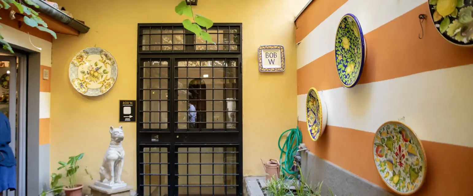 a door with a glass door and a cat statue