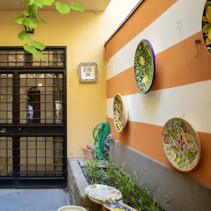 a door with a glass door and a cat statue