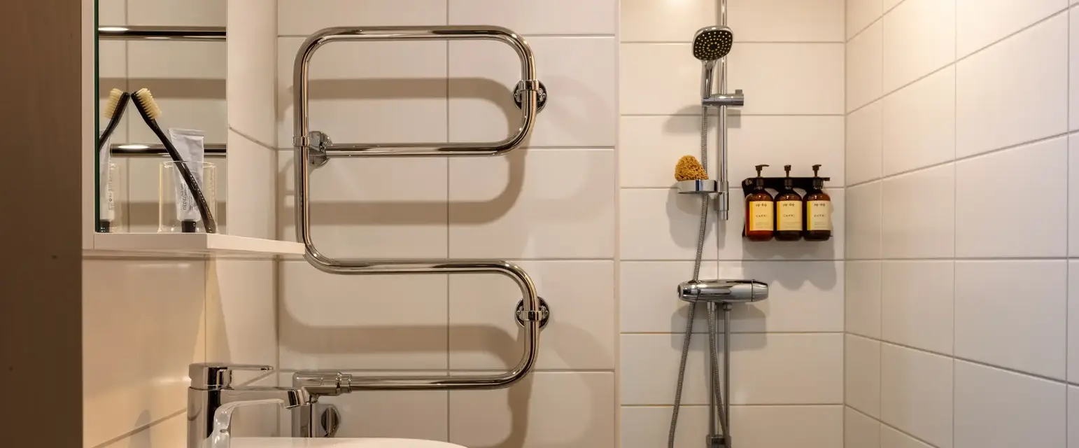 a bathroom with a sink and shower