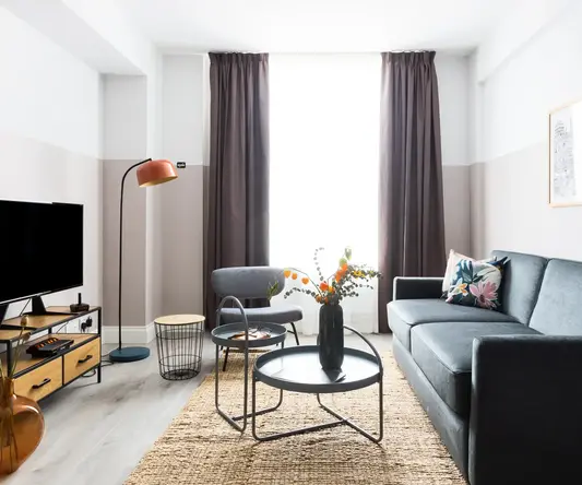 a living room with a couch and a table