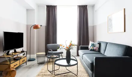 a living room with a couch and a table