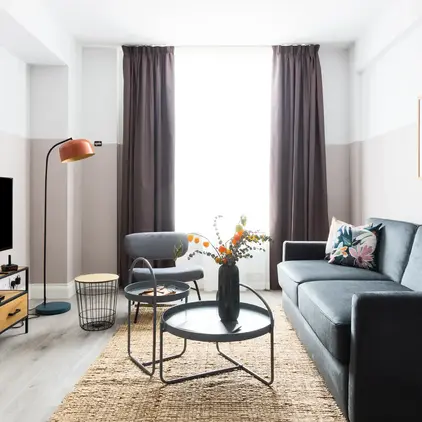 a living room with a couch and a table