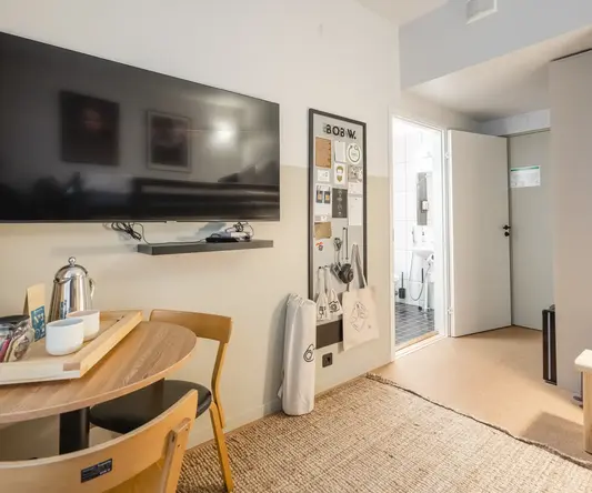 a room with a tv and table