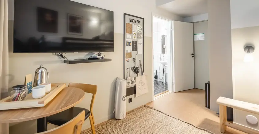 a room with a tv and table