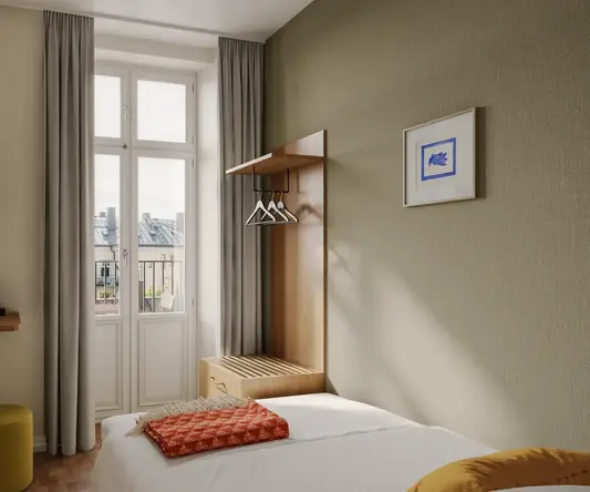 a bedroom with a bed and a window