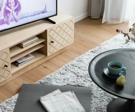 a tv on a stand in a living room
