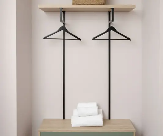 a shelf with swingers and towels on it