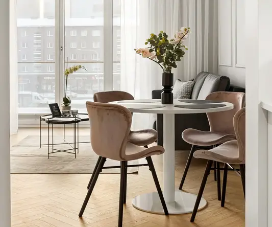 a room with a table and chairs