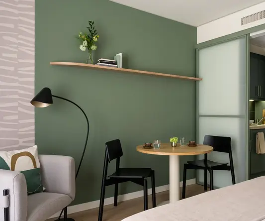 a room with a table and chairs