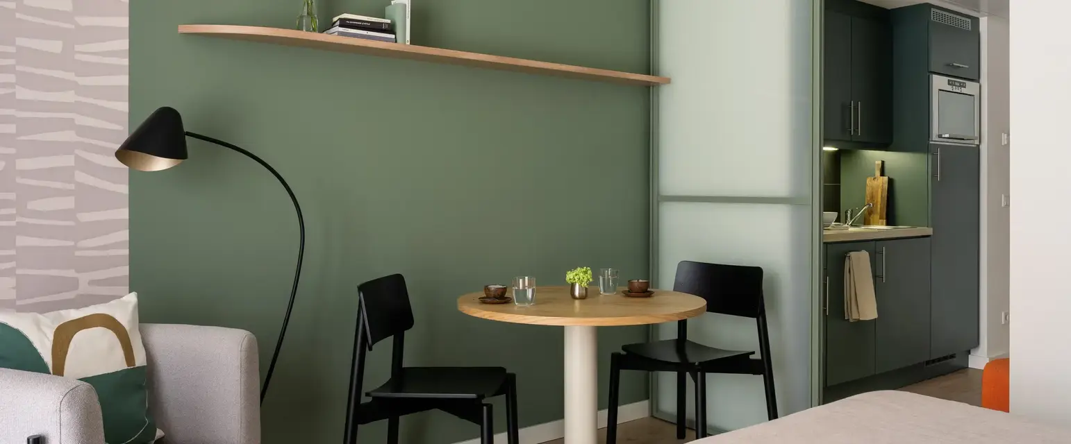 a room with a table and chairs