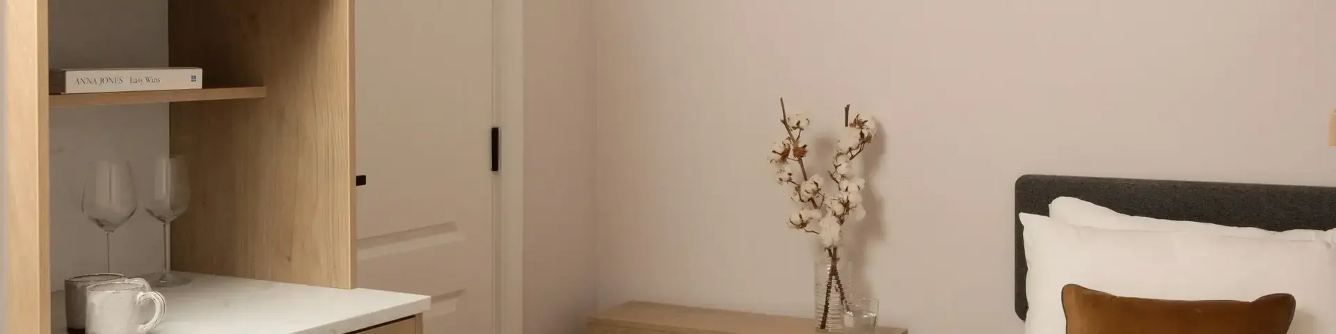 a bedroom with a bed and a bookcase