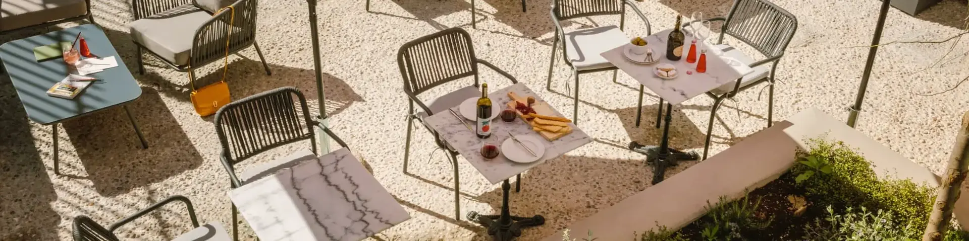 a table and chairs under umbrellas