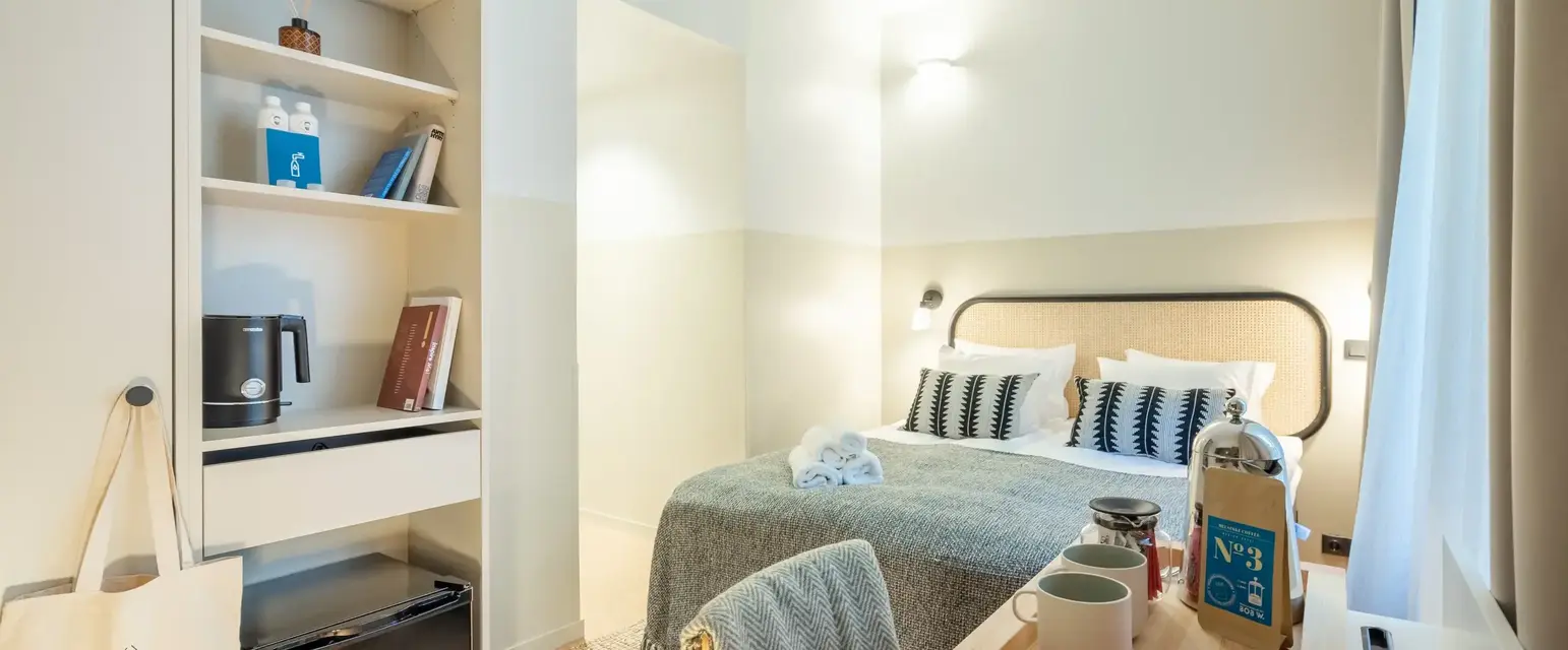 a room with a bed and a desk